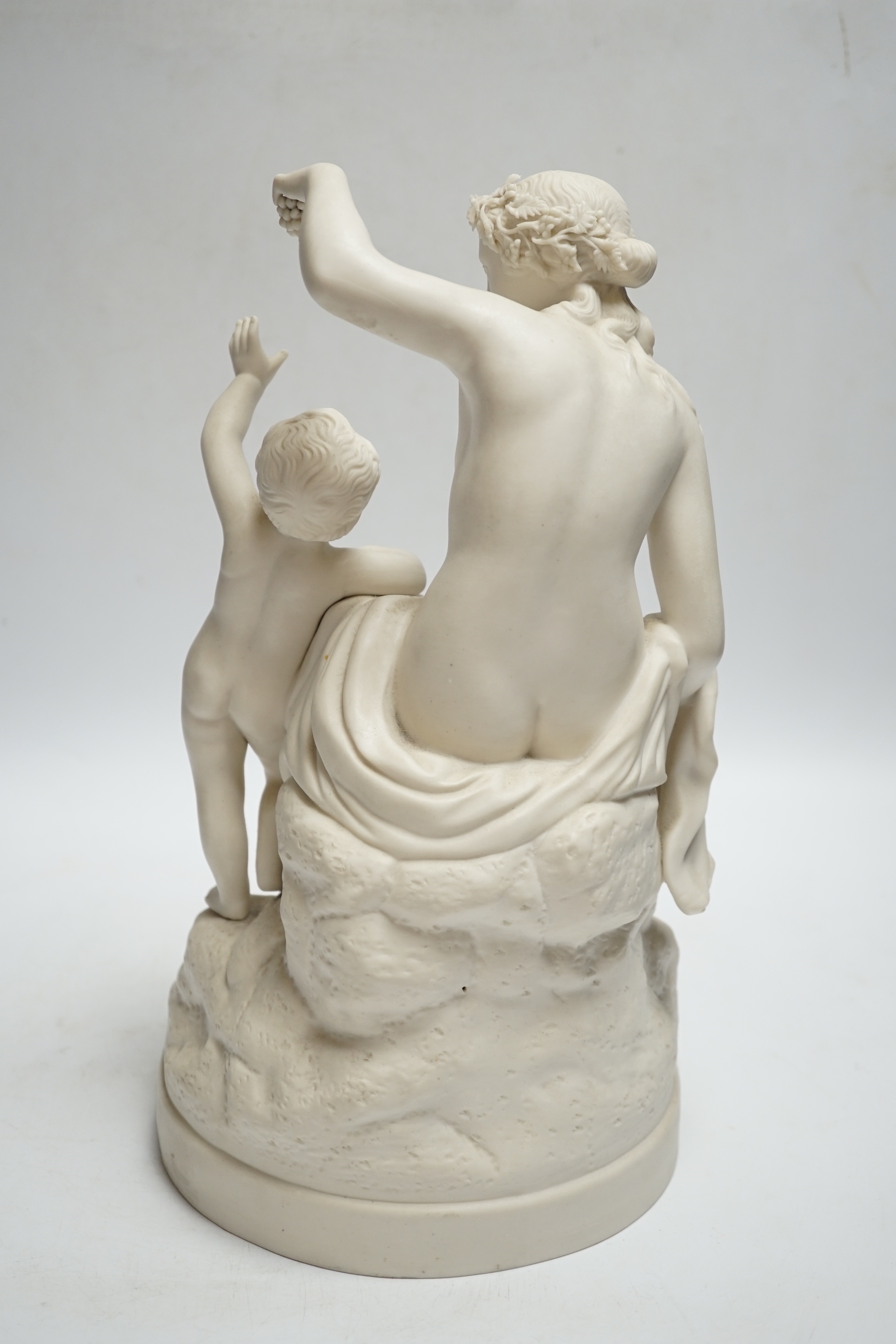 A late 19th century parian group of a goddess and putti, 31cm